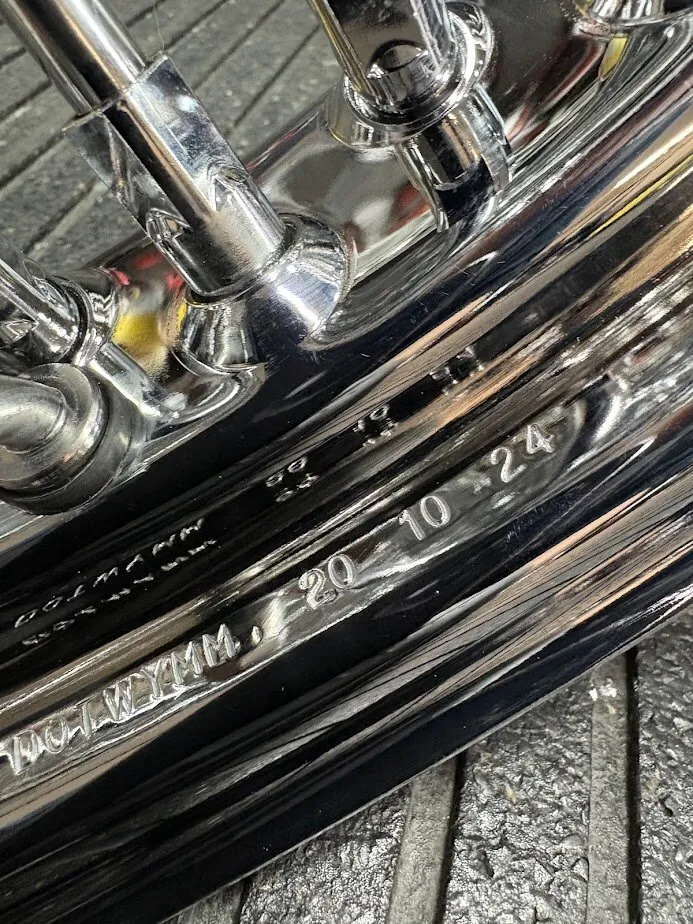 The DOT marking stamped into a spoke rim. Rim markings help identify a wheel and when it was made.