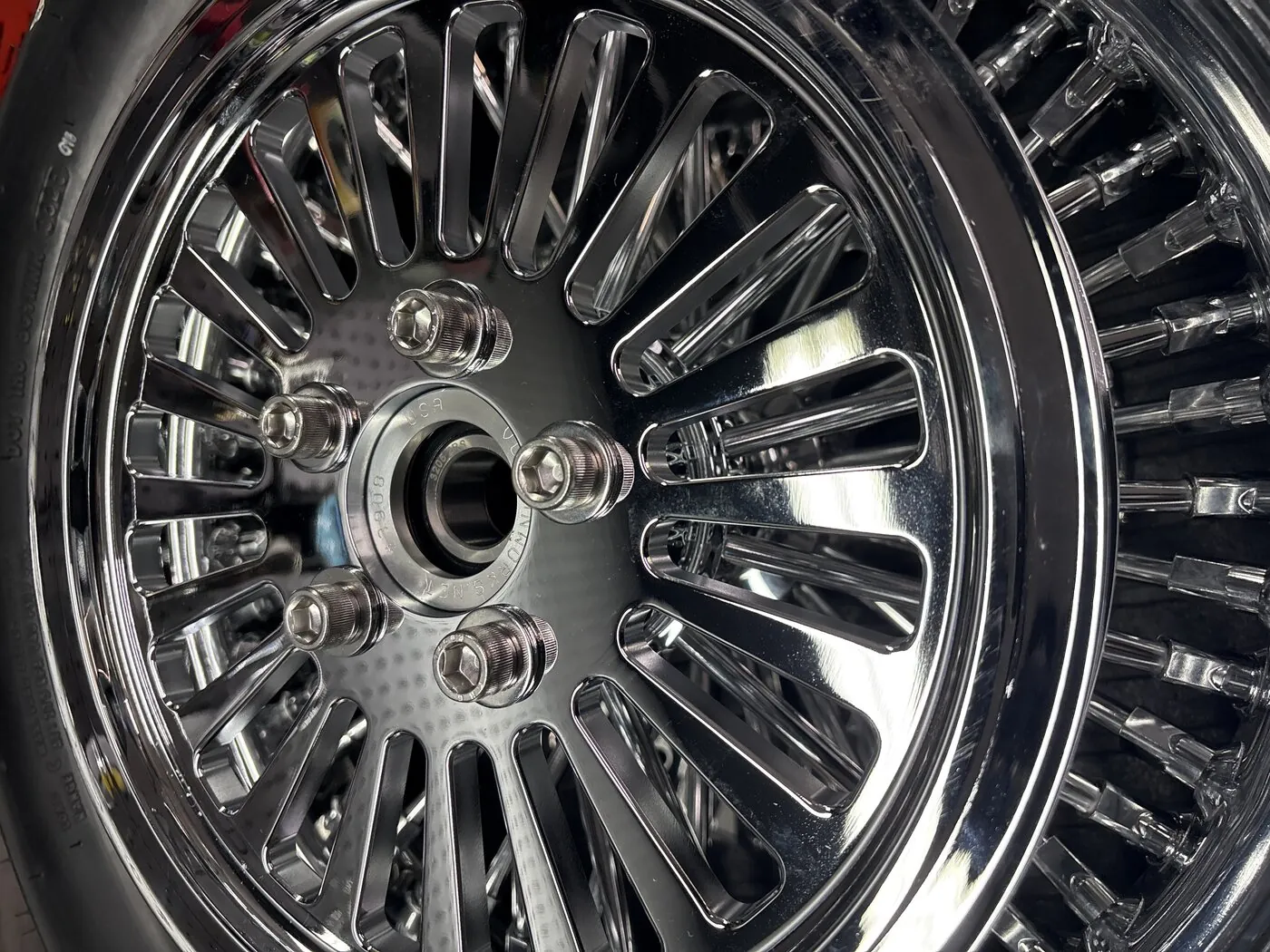 Pulley bolts with washers in a billet rear hub. Every bolt should run in freely by hand before any torque is applied.