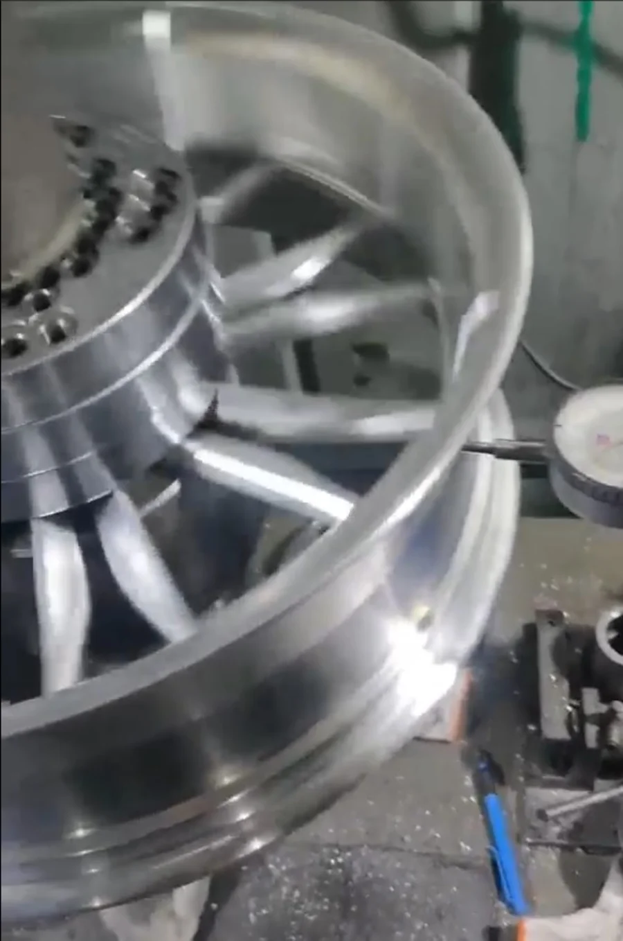 Havoc billet wheel rim being machined and verified on the lathe