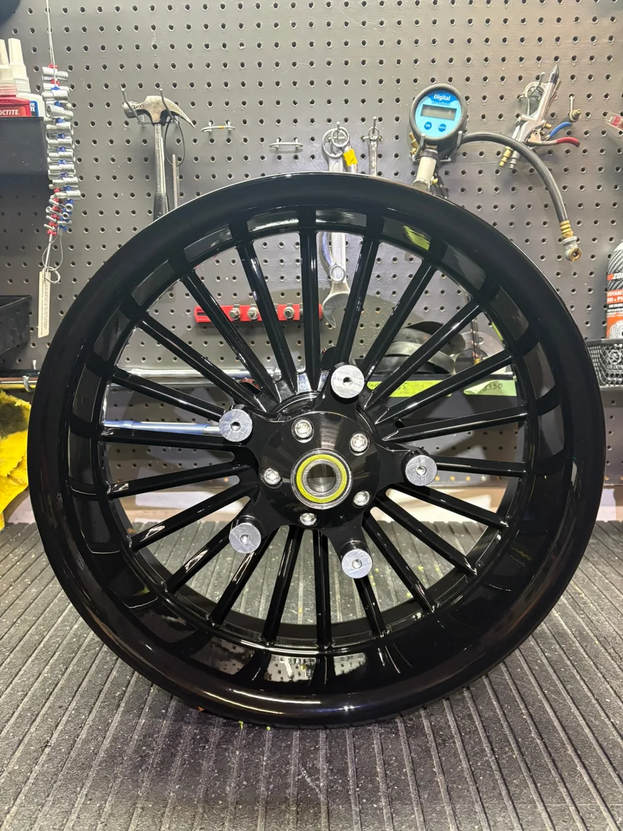 Finished gloss black Havoc billet wheel on the shop bench