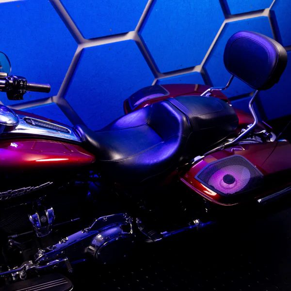 Havoc RGB speakers installed on a Road King with coordinated front highway bar and rear saddlebag illumination