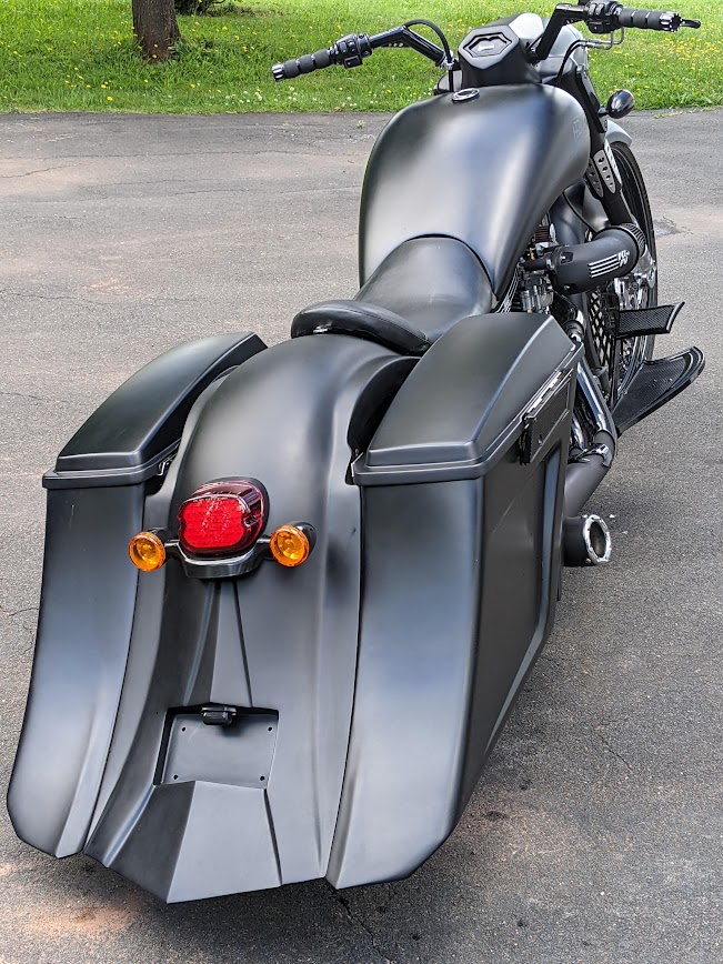 Rear view of a black Havoc 124SS showing its integrated custom bodywork