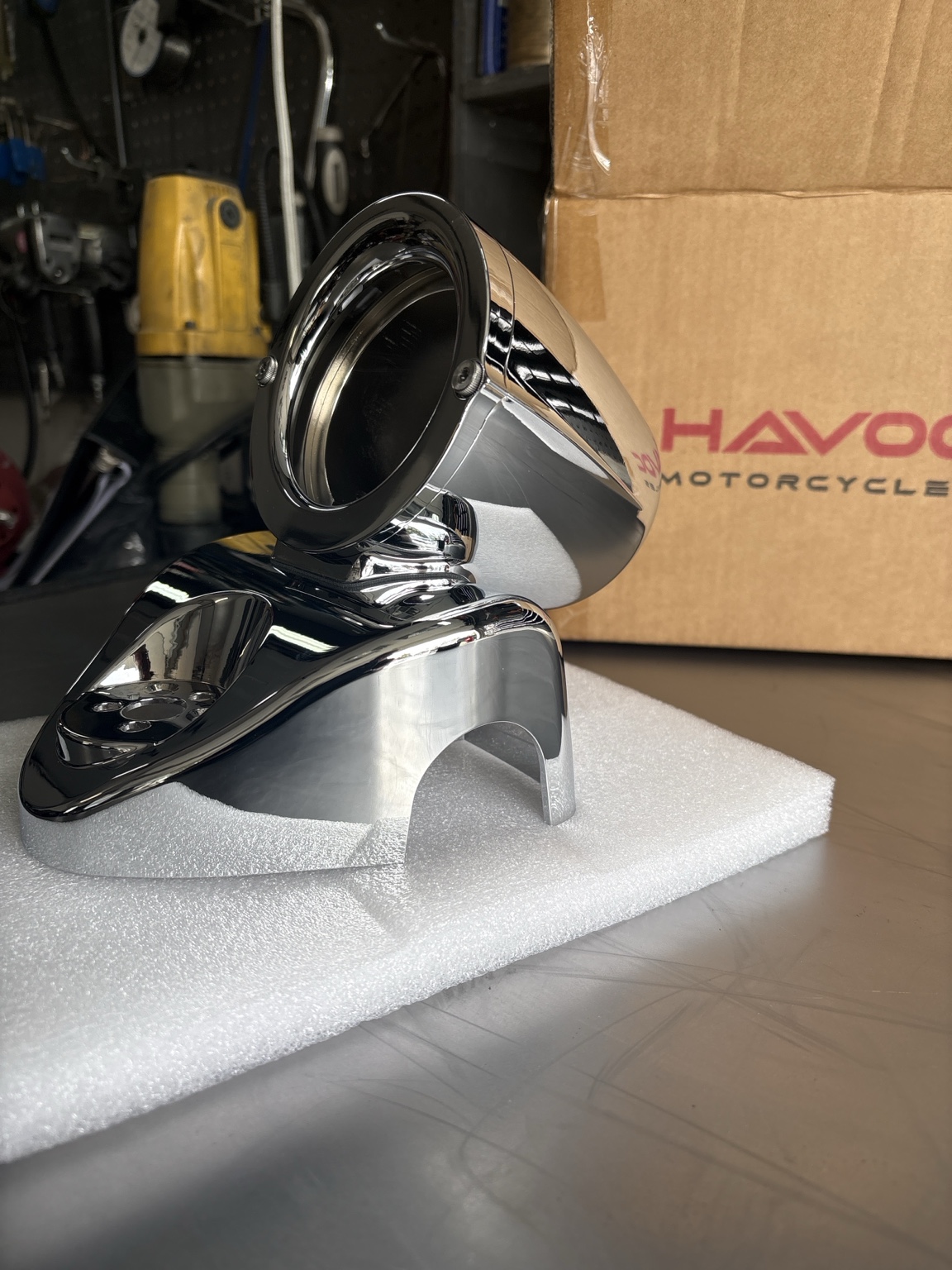 Finished chrome Havoc Roar radio pod photographed on foam packing in the workshop, Havoc Motorcycles box behind