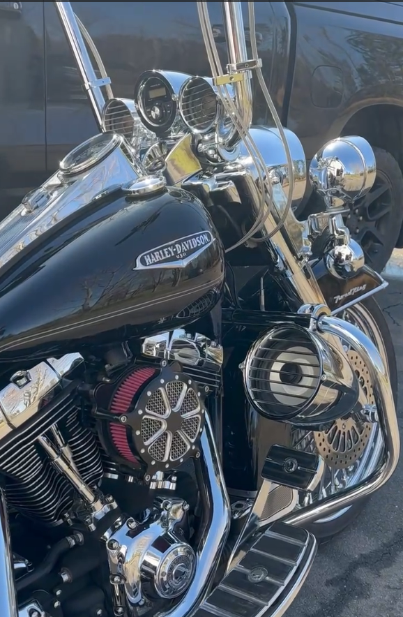 Close-up of the finished Road King front end with the chrome radio pod and gauges up at the bars and the 6.5-inch highway-bar speaker pod on the engine guard