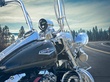 Load image into Gallery viewer, Side view of Harley-Davidson Road King showing Aquatic AV GP1 gauge stereo in billet nacelle pod and 6.5 inch billet highway bar speaker pod on the crash bar
